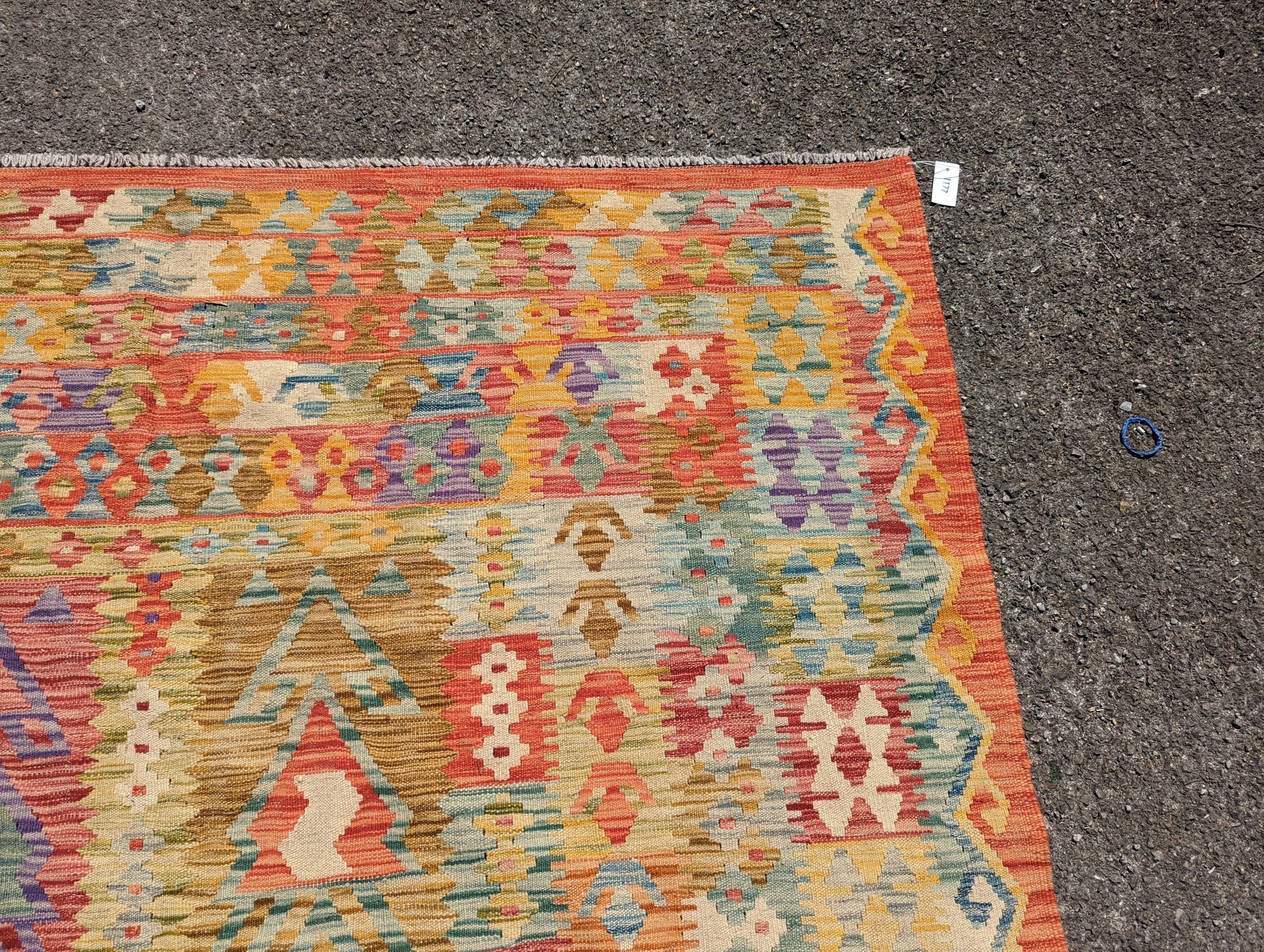 An Anatolian polychrome geometric flatweave Kilim carpet, 290 x 210cm